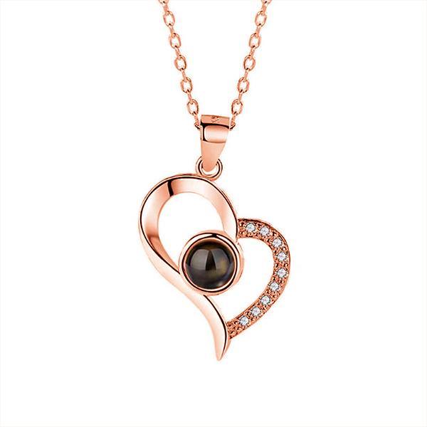 https://www.tdcjewellery.com/cdn/shop/products/Personalized-Heart-Photo-Projection-Necklace-with-I-Love-You-in-100-Languages_2.jpg?v=1635391321